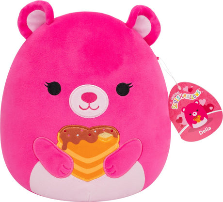 Squishmallows squishmallow valentinsdag - 19 cm plys delia - pink bjørn holder hjertepandekager