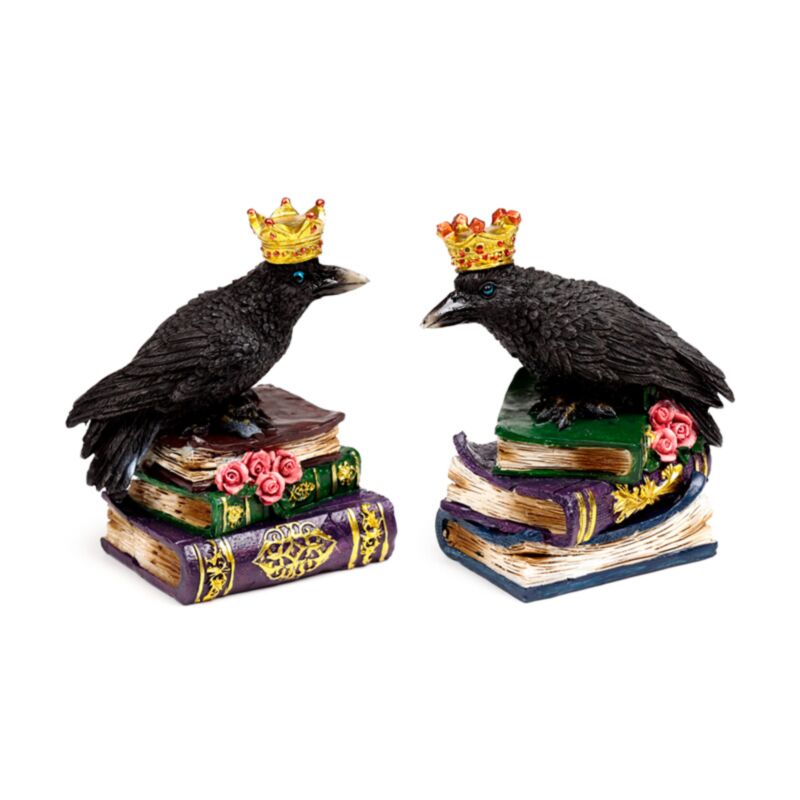 Krage med krone stående på bøger