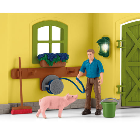 Schleich gårdverden - stor stald, gul spillefigur