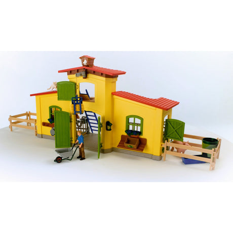 Schleich gårdverden - stor stald, gul spillefigur