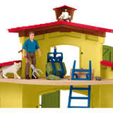 Schleich gårdverden - stor stald, gul spillefigur