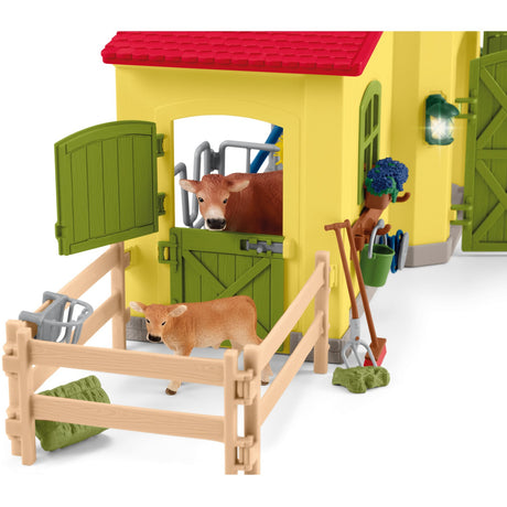 Schleich gårdverden - stor stald, gul spillefigur